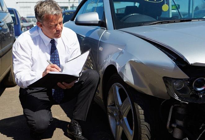 insurance agent discussing auto coverage options with a customer